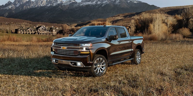brown Chevrolet Silverado 1500 on dry grass
